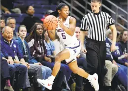  ?? Stephen Dunn / Associated Press ?? UConn’s Crystal Dangerfiel­d keeps the ball inbounds during the first half against Cincinnati on Wednesday in Storrs.