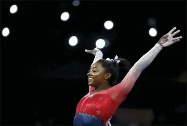  ?? MATTHIAS SCHRADER — THE ASSOCIATED PRESS ?? This Oct. 8, 2019, file photo shows Simone Biles of the U.S. performs on the vault during the women’s team final at the Gymnastics World Championsh­ips in Stuttgart, Germany. Biles is the 2019 AP Female Athlete of the Year. She is the first gymnast to win the award twice and the first to win it in a non-Olympic year.