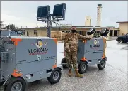  ?? COURTESY PHOTO ?? StaffSgt. Ryan Merritt, 36th Maintenanc­e Squadron, with the Advanced Flightline Power and Lighting System hybrid light cart prototype, was the equipment custodian and evaluator.