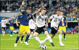  ?? Picture: GETTY IMAGES ?? DANCING TO DIFFERENT TUNE: Marco Reus of Germany controls the ball as Sweden’s Victor Lindelof closes in, in the teams’ World Cup match at Fisht Stadium in Sochi, Russia on Saturday. Reus will be key to Germany’s hopes of securing a berth in the last...