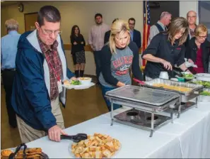  ?? WILLIAM HARVEY/RIVER VALLEY & OZARK EDITION ?? Doug Priester, left, and Sarah Meyer partake of the food at the Maumelle State of the City luncheon at the Jess Odom Community Center. Maumelle was named a Volunteer Community of the Year in 2016, the 12th time since 2002.