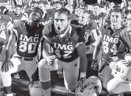  ?? Courtesy of Casey Brooke Lawson, IMG Academy ?? Dante Sparaco celebrates with his teammates at IMG Academy in Florida. Sparaco transferre­d to play at the football powerhouse this fall.