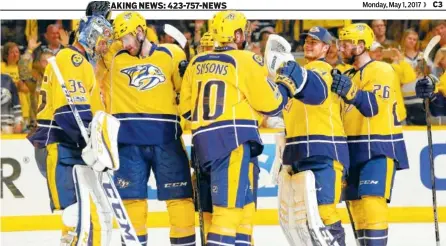  ?? THE ASSOCIATED PRESS ?? The Nashville Predators celebrate after defeating the St. Louis Blues 3-1 in Game 3 of a second-round NHL playoff series on Sunday.