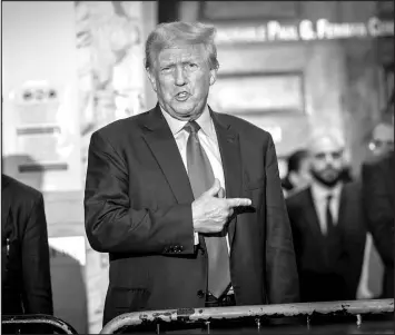  ?? STEFAN JEREMIAH / ASSOCIATED PRESS ?? Former President Donald Trump talks to the media Tuesday during a break of his civil business fraud trial at New York Supreme Court.