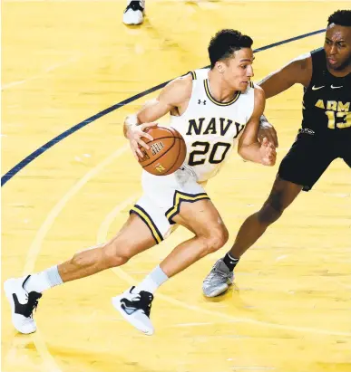  ?? PAUL W. GILLESPIE/CAPITAL GAZETTE ?? Navy junior Greg Summers, pictured driving towards the basket against Army’s Lonnie Grayson on Jan. 23, said the team has built a strong bond on and off the court.