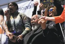  ?? Santiago Mejia / The Chronicle ?? A Methodist bishop accuses retired Rev. Cecil Williams (center) of Glide Memorial Church, shown at a rally outside San Francisco’s City Hall last week, of disregardi­ng church rules.