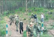  ??  ?? A bomb squad defuses an IED planted by the terrorists under a culvert on the JammuRajou­ri-Poonch National Highway; and Ismal Alvi (left), a Jaish-e-Mohammad commander, killed in an exchange of fire with security forces in Pulwama, on Saturday.