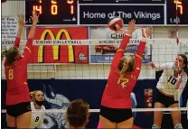  ??  ?? Chico’s Brynn Alves (8) and Macy Mattern (12) attempt to defend a shot by Pleasant Valley’s Sophioa Winter (10) in the second game of a rivalry match Wednesday at Varley Gym in Chico.