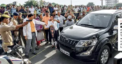  ??  ?? POINT BLANK Police officers examine the car of Vivek Tiwari, who was shot by a constable at a checkpoint in Lucknow