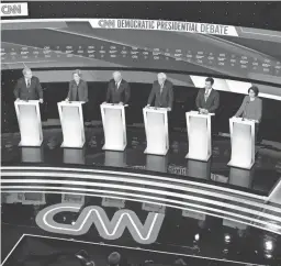  ??  ?? From left, Democratic candidates Tom Steyer, Sen. Elizabeth Warren, former Vice President Joe Biden, Sen. Bernie Sanders, former South Bend Mayor Pete Buttigieg and Sen. Amy Klobuchar on stage Tuesday in Des Moines, Iowa. AP