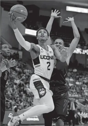  ?? JESSICA HILL/AP PHOTO ?? UConn’s Jalen Adams (2), who was named AAC Player of the Week after leading the Huskies to comeback wins over Memphis and Temple, hopes to lead the Huskies to their fifth straight win at Houston tonight.