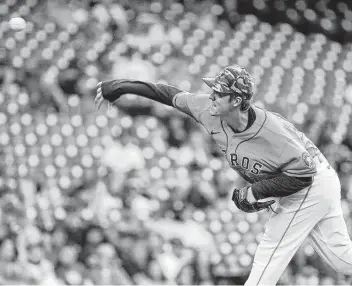  ?? Photos by Jon Shapley / Staff photograph­er ?? Astros starting pitcher Zack Greinke allowed three runs on seven hits while striking out five over seven innings. Though he had walked six in his previous 12 innings, he allowed just one free pass on Friday.