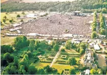  ?? ?? Lord Cobbold outside Knebworth House in 1998, and, right, Oasis performing at Knebworth Park in 1996