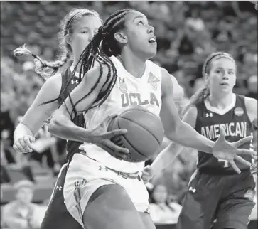  ?? Photograph­s by Luis Sinco Los Angeles Times ?? MONIQUE BILLINGS scored a team-high 20 points to go with 10 rebounds against American.