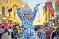  ??  ?? Party people: Fans of Morocco, Iceland, the host nation and Peru have brought colour and passion to the tournament