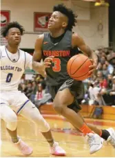  ?? ALLEN CUNNINGHAM/FOR THE SUN-TIMES ?? Isaiah Holden had 24 points in Evanston’s victory Saturday against Bloom at the When Sides Collide Shootout.