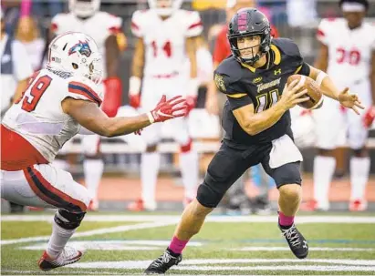  ?? COURTESY OF ENP PHOTOGRAPH­Y ?? Tom Flacco has developed into a dual-threat quarterbac­k for Towson, which has risen to a No. 13 ranking in the Football Championsh­ip Subdivisio­n. Flacco leads the Tigers in rushing with 326 yards and has also thrown for 1,482 yards and 14 touchdowns this season.