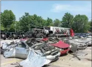  ?? BILL DEBUS — THE NEWS-HERALD ?? This is what was left of 10 junk cars after the Raminator monster truck ran over and crushed them on June 17 during an exhibition at Adventure Chrysler Jeep Dodge Ram in Willoughby.