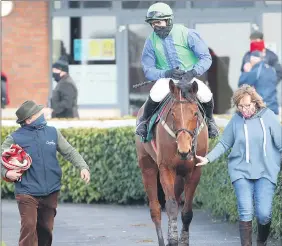  ?? (Photo: Caroline Norris/Racing Post) ?? Liam Burke walks in with Rebel Early, Darragh O’Keeffe and Mary Phelan, following their success at Navan on Saturday.