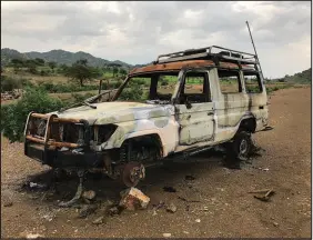  ?? THE NEW YORK TIMES (2021) ?? A provided image shows the car that carried Maria Hernandez, Yohannes Halefom and Tedros Gebremaria­m before they were assassinat­ed in Ethiopia’s Tigray region, outside Shewate Hegum, Ethiopia, on Aug. 12, 2021. The three employees of Doctors Without Borders set out to rescue the wounded in a war zone in northern Ethiopia. Their fate shows the treacherou­s path for many aid workers in conf lict zones.