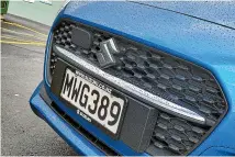  ??  ?? The hybrid Swift gets a different grille with that big chrome horizontal bar.