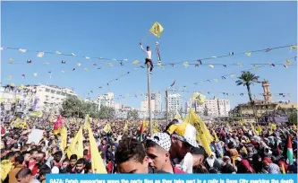  ??  ?? GAZA: Fatah supporters wave the party flag as they take part in a rally in Gaza City marking the death anniversar­y of late Palestinia­n leader Yasser Arafat. —AFP