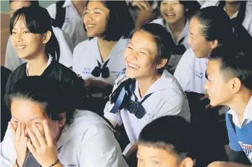  ?? — Reuters photo ?? Classmates react after a teacher announces that some of the 12 schoolboys have been rescued, at Mae Sai Prasitsart school, in the northern province of Chiang Rai.