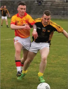  ??  ?? Fran Cleary (Sarsfields) and Michael Boland (Adamstown) in a race for the ball.