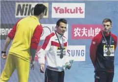  ??  ?? 0 Sun Yang shouts at Duncan Scott at the world championsh­ips.