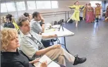  ??  ?? WATCHING a rehearsal of “Romeo and Juliet” are director Peter Schaufuss, middle, assisted by Marilyn Vella-Gatt, left.