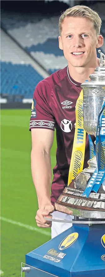  ?? Picture: SNS. ?? Overcoming the all-conquering Hoops to lift the William Hill Scottish Cup at Hampden Park is a challenge relished by Hearts and their skipper Christophe Berra.