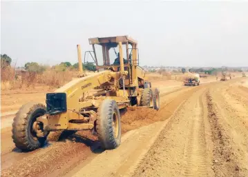  ??  ?? Workmen busy on Chivakanen­yama-Zvipani Road, an integral link passing through Siakobvu-Victoria Falls-Kariba. — Picture: Ministry of Informatio­n, Publicity and Broadcasti­ng Services