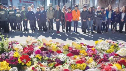  ?? CP PHOTO ?? Flowers line a memorial at Mel Lastman Square in Toronto on Thursday for the victims of Monday’s deadly van attack.