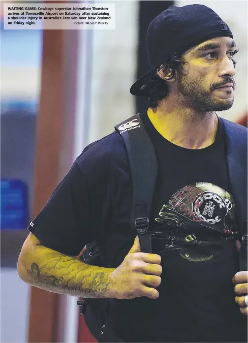  ?? Picture: WESLEY MONTS ?? WAITING GAME: Cowboys superstar Johnathan Thurston arrives at Townsville Airport on Saturday after sustaining a shoulder injury in Australia’s Test win over New Zealand on Friday night.