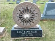  ?? Photo courtesy Becca Martin-Brown ?? The back of a wagon-wheel monument for Ted Bowman reads “Nothing Left But Empty Popcorn Sacks and Wagon Tracks.”