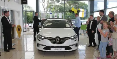  ??  ?? Tadhg Furlong launched the new Renault Megane in Menapia Motors with the help of Barry Devereux.