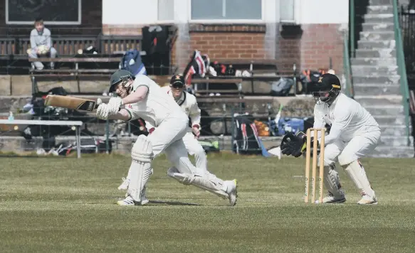  ??  ?? South Shields opener Luke Elliott batting against Littletown, watched by wicketkeep­er Tom Nicholson, on Saturday.