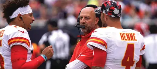  ?? AP PHOTOS ?? ABOVE: Nagy rejoined Chiefs quarterbac­k Patrick Mahomes (with backup Chad Henne) after four seasons as the Bears’ coach. BELOW: Nagy worked one season with Bears quarterbac­k Justin Fields and had nothing but praise for him. ‘‘He’s one helluva player,’’ Nagy said. ‘‘He has a bright future in Chicago.’’