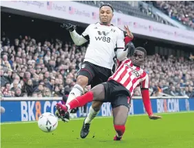  ?? ?? Fulham’s Kenny Tete and Sunderland’s Abdoullah Ba battle for the ball.