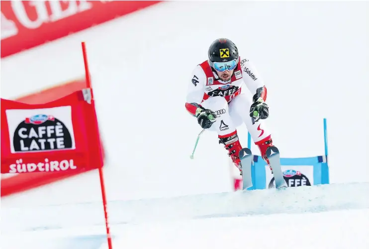  ?? — GETTY IMAGES ?? Marcel Hirscher of Austria powered his way to a record fifth straight win this season in the Alta Badia giant slalom on Sunday in Alta Badia, Italy.