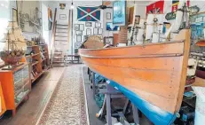  ?? Photo / Danielle Zollickhof­er ?? Peter Vandersloo­t restored the old Victorian rowing boat (right) and donated it to the museum.