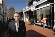  ?? Mel Melcon Los Angeles Times ?? RICK CARUSO at Palisades Village, which is among his properties that will accept bitcoin for rent.