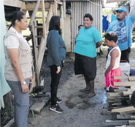  ?? Ministry of Health and Medical Services. ?? Minister for Health and Medical Services, Rosy Akbar, second left, while visiting the families in Saravi Settlement in Nadi.