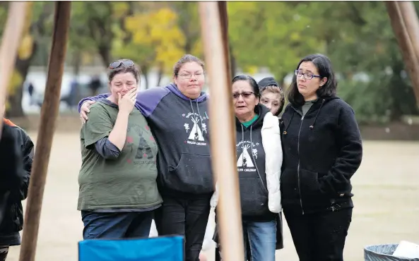  ?? TROY FLEECE ?? It’s an emotional moment as members of the Justice for Our Stolen Children camp take down the final teepee in Wascana Park.