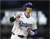  ?? MARK J. TERRILL – THE ASSOCIATED PRESS ?? The Dodgers’ Shohei Ohtani circles the bases after hitting his fourth home run of the season in the first inning against the Padres on Friday.
