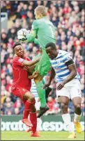  ??  ?? Queens Park Rangers goalkeeper Robert Green (center), makes a save from Liverpool’s Raheem Sterling (left), during their English Premier League soccer match at Anfield, Liverpool, England, May 2. (AP)