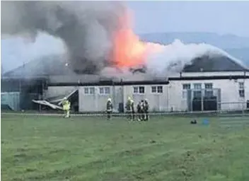  ??  ?? Up in flames The fire ripped through Ballanatra­e Primary School last Monday night