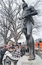  ?? NEAL HAMBERG/AP 1998 ?? Native Americans from tribes around New England will gather near the bronze statue of Massasoit before marching through Plymouth’s historic district on Thursday.