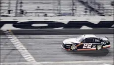  ?? Jared C. Tilton / Getty Images ?? Austin Cindric crosses the finish line to win the NASCAR Xfinity Series opener at Daytona Internatio­nal Speedway on Saturday. He’ll follow up the win by racing in the Daytona 500 on Sunday.