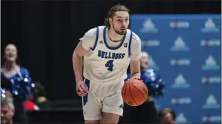 ?? JACOB KUPFERMAN — THE ASSOCIATED PRESS ?? Drew Pember, a 6-foot-11 center, is averaging 21.2 points per game this season for UNC Asheville (27-7).